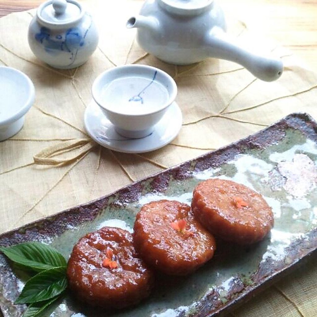 Tea service set on a hanji mat with confections