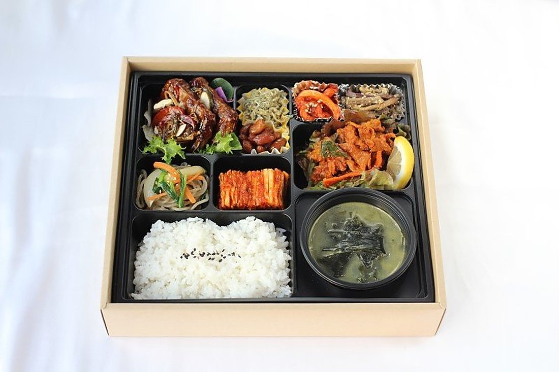 A single Korean bento box, styled for product photography
