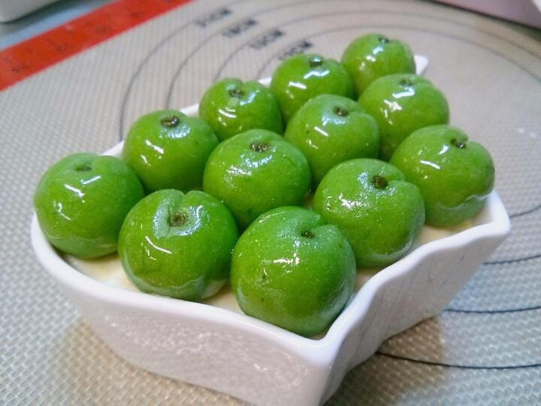 Rice cakes shaped and colored as green apples