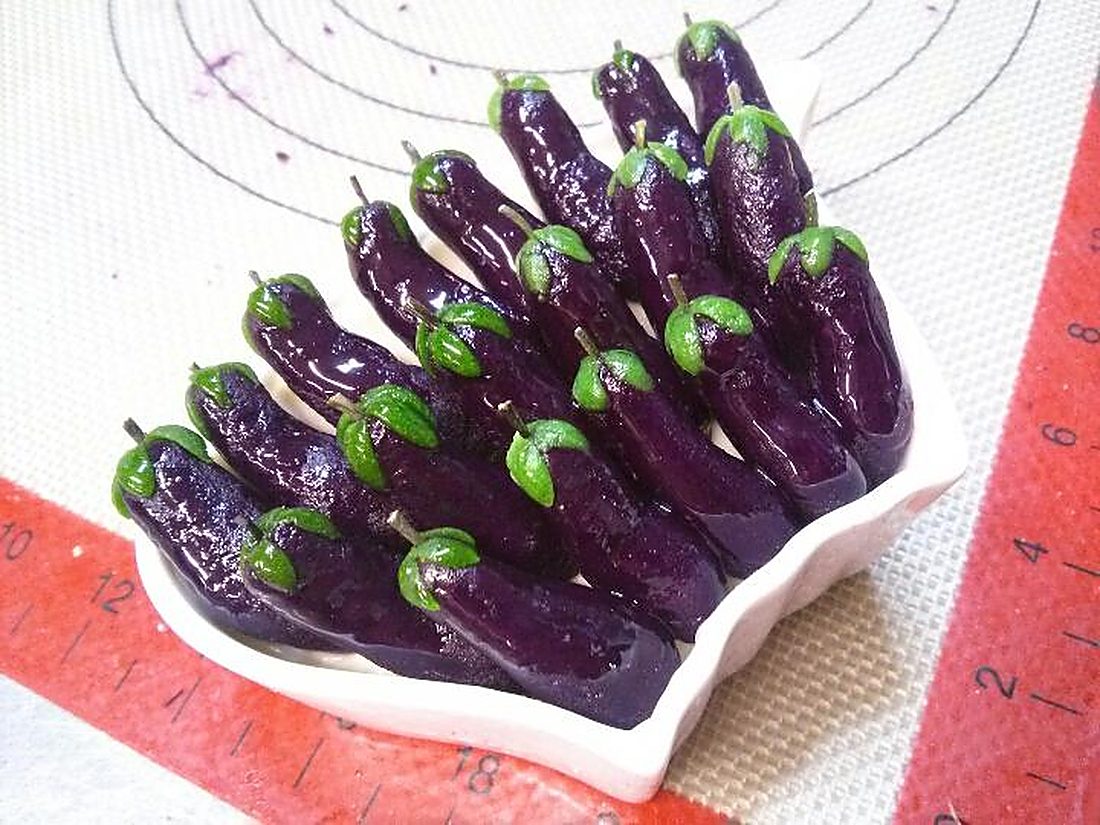 Rice cakes shaped as purple eggplants