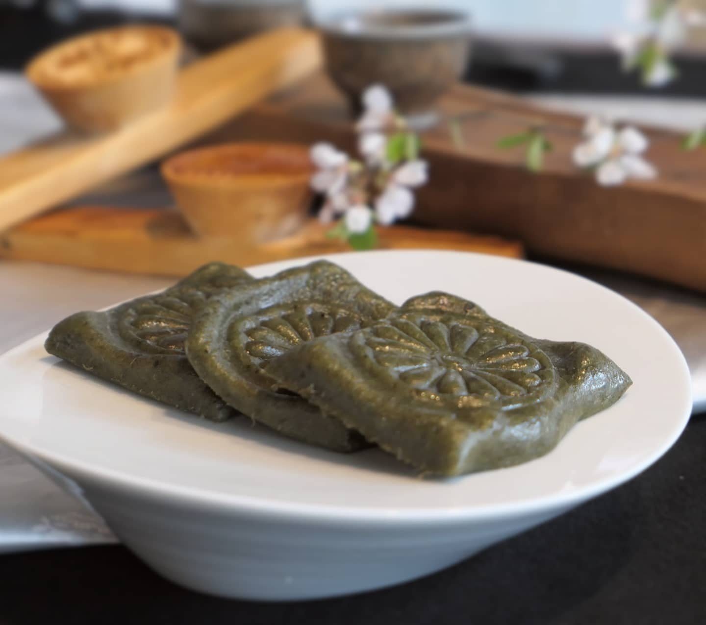 Mugwort songpyeon rice cakes on a white dish