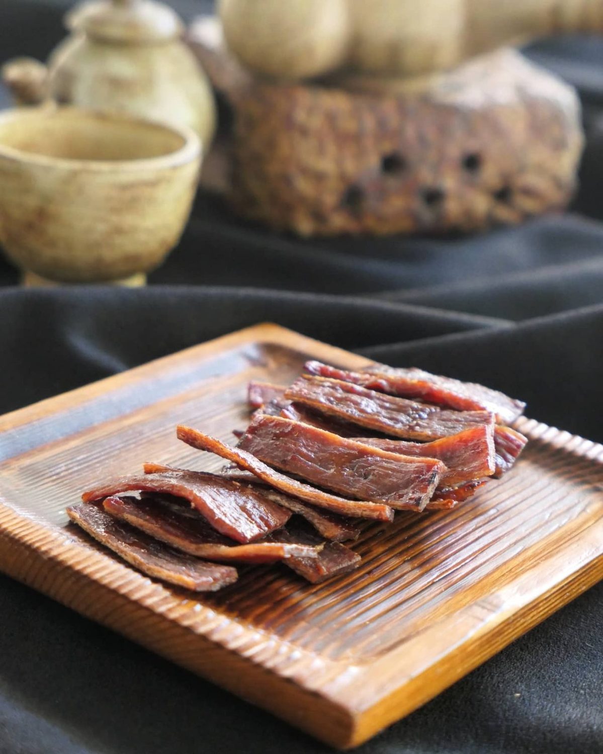 Sliced beef jerky yukpo on a wooden board