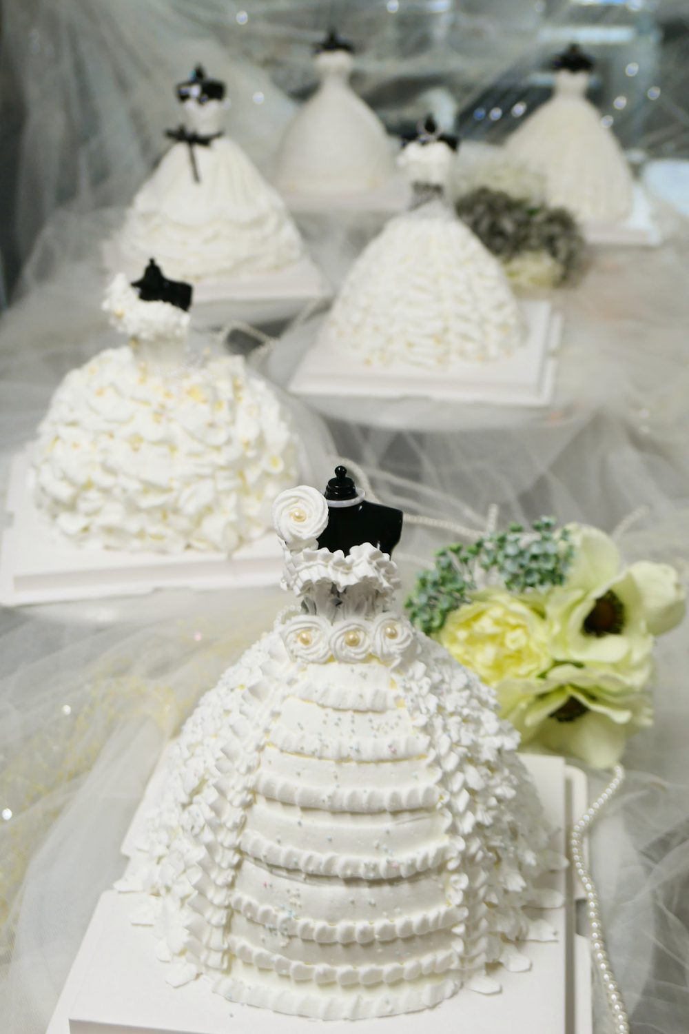 Wedding dress cake with piped floral detail