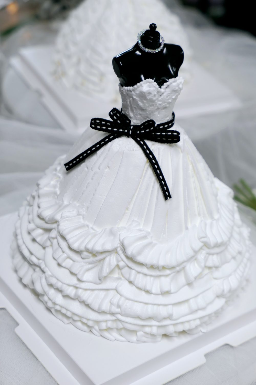 Wedding dress shaped buttercream cake in white